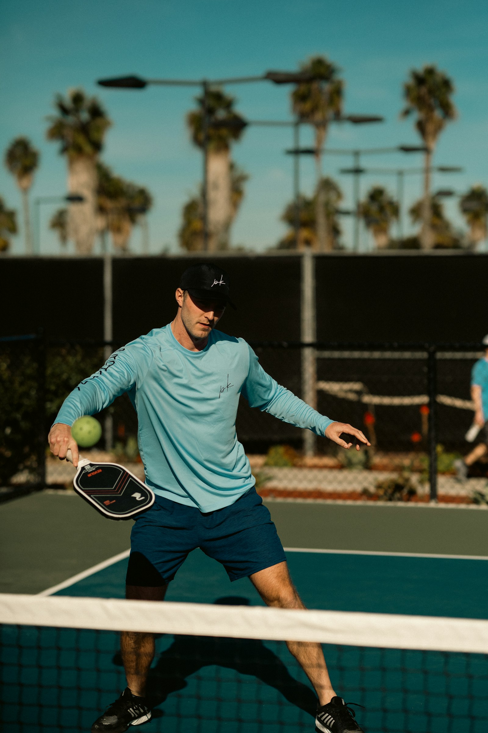 Athlete mid-swing on an outdoor court